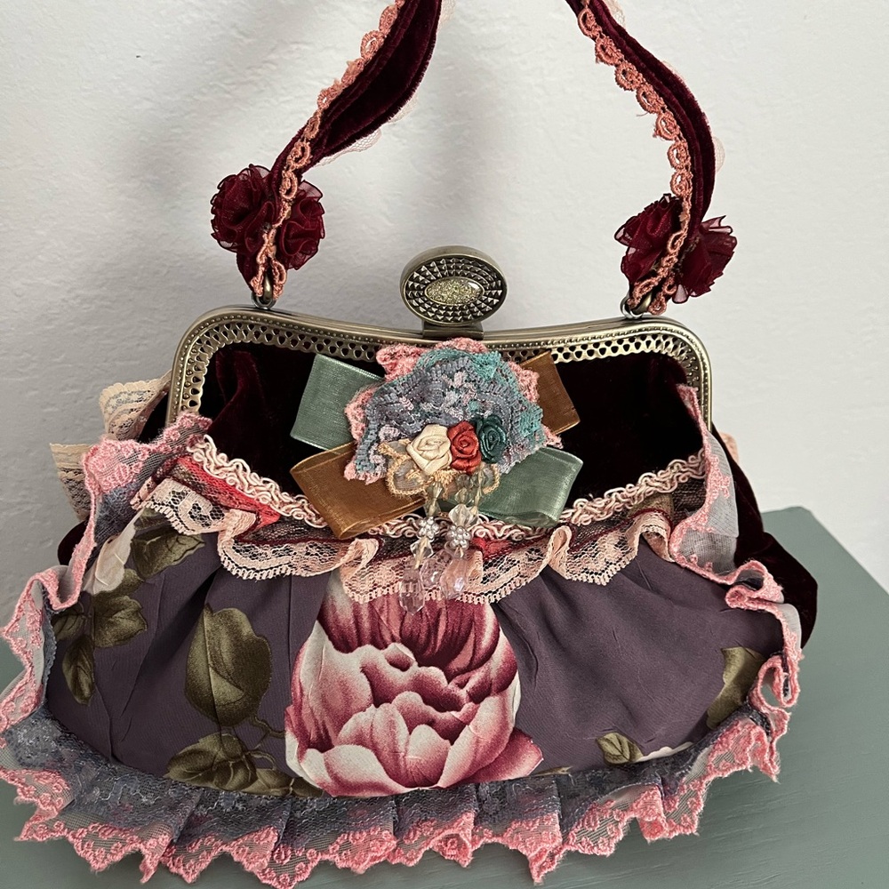Vintage-inspired floral cloth and velvet handbag